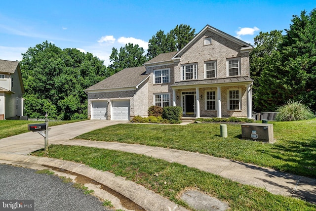 1903 Scottish Isle Ct, Abingdon, MD 21009 - view of front facade with an attached garage, concrete driveway, brick siding, and a porch