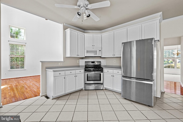 1903 Scottish Isle Ct, Abingdon, MD 21009 - kitchen with appliances with stainless steel finishes, white cabinetry, and light tile patterned floors