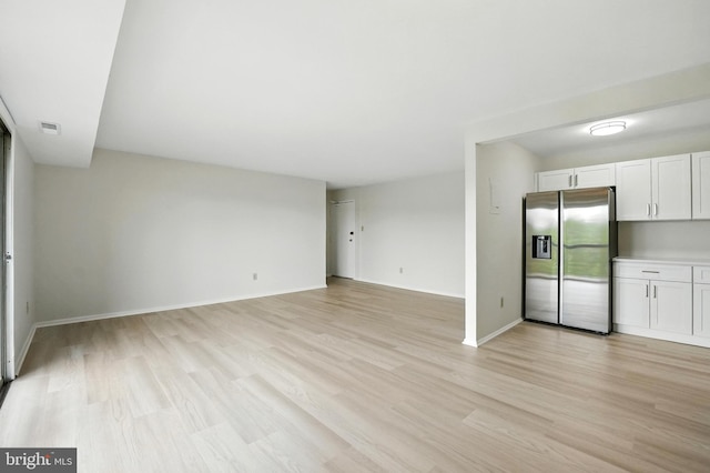 218 Locust St SE Unit 151, Vienna, VA 22180 - unfurnished living room with light wood-type flooring