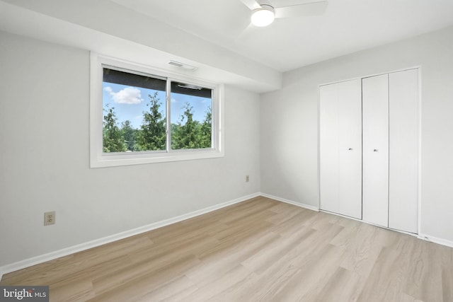 218 Locust St SE Unit 151, Vienna, VA 22180 - unfurnished bedroom featuring light wood-style floors, a closet, and a ceiling fan