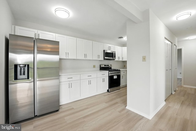218 Locust St SE Unit 151, Vienna, VA 22180 - kitchen featuring appliances with stainless steel finishes, light wood-style flooring, white cabinets, and light countertops
