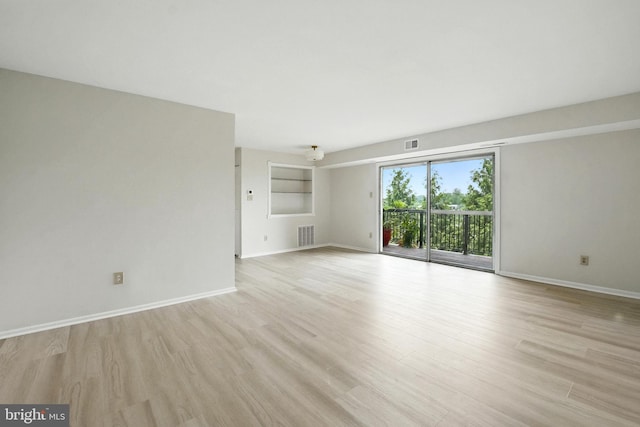 218 Locust St SE Unit 151, Vienna, VA 22180 - unfurnished living room with light wood-style floors