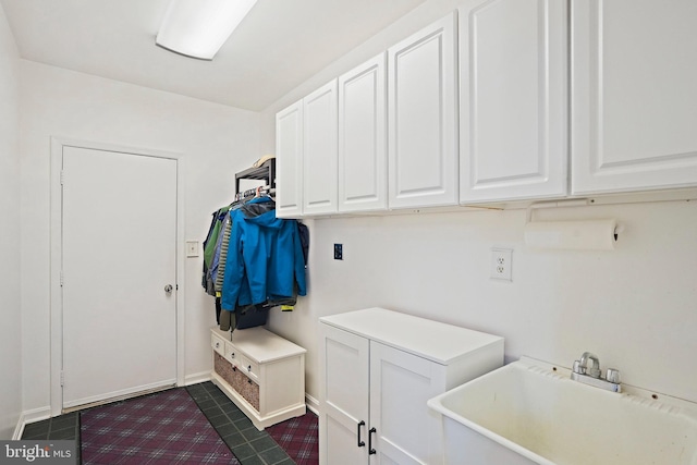 408 Maravista Ct, Silver Spring, MD 20905 - laundry room with a sink and dark tile patterned flooring