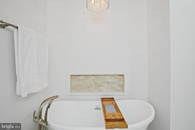 408 Maravista Ct, Silver Spring, MD 20905 - bathroom featuring a freestanding bath and a chandelier