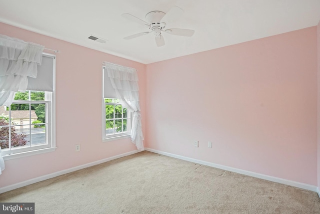 408 Maravista Ct, Silver Spring, MD 20905 - spare room featuring carpet, baseboards, and a ceiling fan