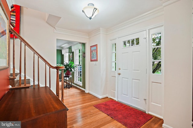 408 Maravista Ct, Silver Spring, MD 20905 - entrance foyer featuring wood finished floors, baseboards, stairs, and crown molding