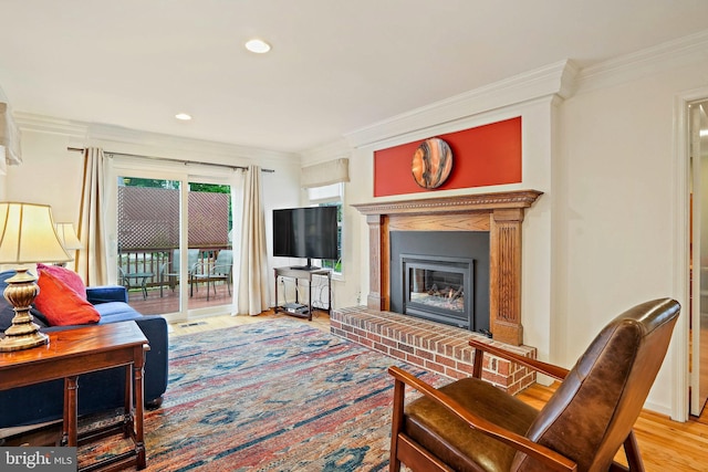 408 Maravista Ct, Silver Spring, MD 20905 - living area featuring wood finished floors, a brick fireplace, crown molding, and recessed lighting