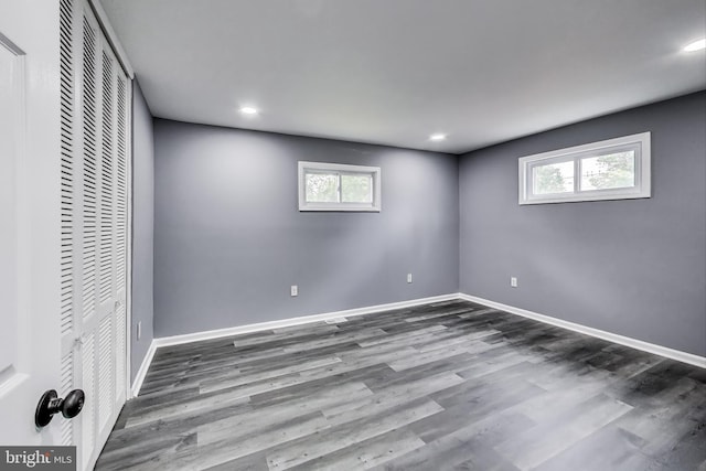 2500 Gehb Ave, Baltimore, MD 21227 - unfurnished bedroom with a closet, wood finished floors, baseboards, multiple windows, and recessed lighting