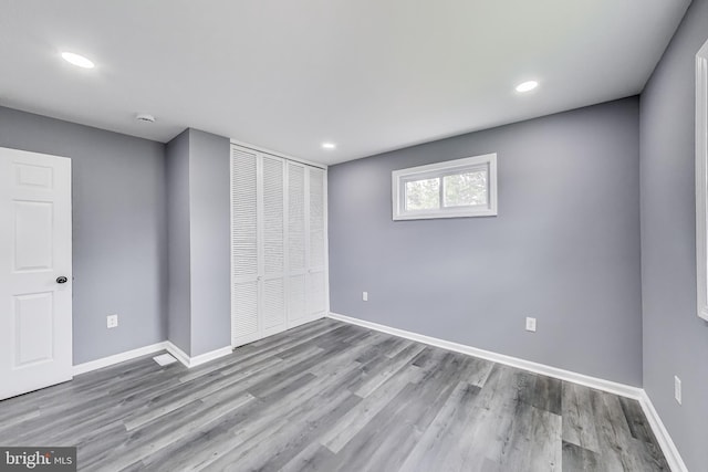 2500 Gehb Ave, Baltimore, MD 21227 - unfurnished bedroom with baseboards, wood finished floors, and recessed lighting