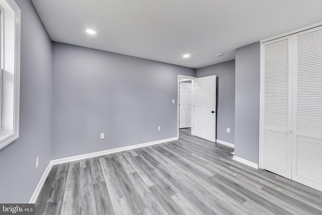 2500 Gehb Ave, Baltimore, MD 21227 - unfurnished bedroom with baseboards, light wood-style floors, a closet, and recessed lighting
