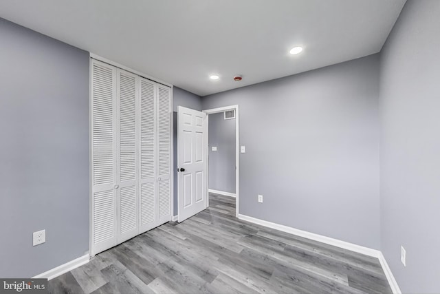 2500 Gehb Ave, Baltimore, MD 21227 - unfurnished bedroom featuring baseboards, wood finished floors, a closet, and recessed lighting