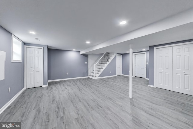 2500 Gehb Ave, Baltimore, MD 21227 - finished below grade area with stairway, wood finished floors, recessed lighting, and baseboards