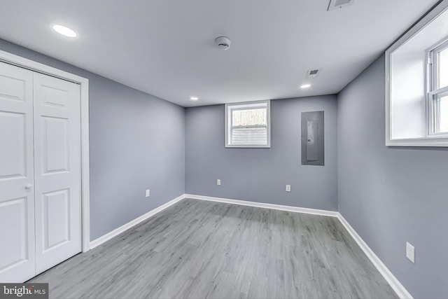 2500 Gehb Ave, Baltimore, MD 21227 - below grade area with electric panel, wood finished floors, baseboards, and recessed lighting