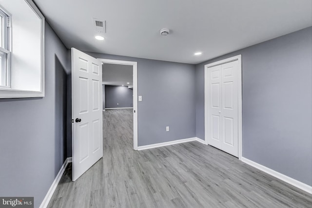 2500 Gehb Ave, Baltimore, MD 21227 - spare room featuring light wood-style flooring, baseboards, a smoke detector, and recessed lighting