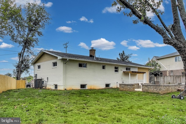 2500 Gehb Ave, Baltimore, MD 21227 - back of property featuring a chimney and central AC