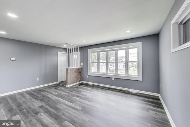 2500 Gehb Ave, Baltimore, MD 21227 - unfurnished living room featuring baseboards, recessed lighting, and wood finished floors