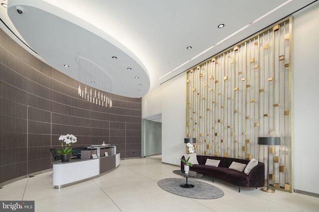 2101 Market St Unit 902, Philadelphia, PA 19103 - common area featuring a towering ceiling, recessed lighting, and tile walls