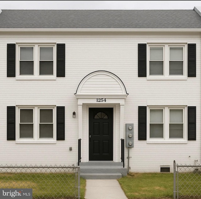 1254 Meigs Pl NE, Washington, DC 20002 - doorway to property with a shingled roof