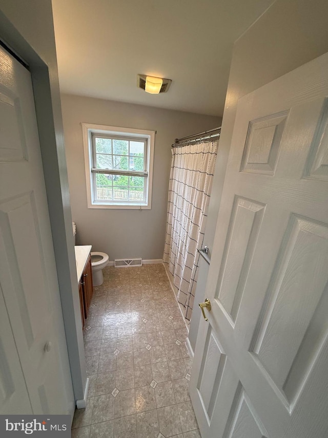 3948 Laurel Run, Columbia, PA 17512 - bathroom featuring vanity, toilet, baseboards, a shower with curtain, and tile patterned floors