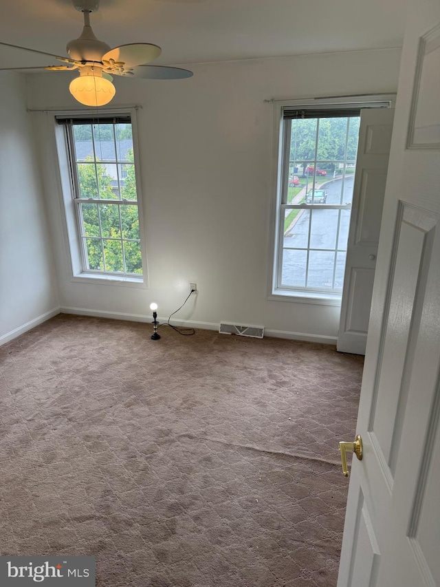 3948 Laurel Run, Columbia, PA 17512 - unfurnished room featuring plenty of natural light, dark carpet, baseboards, and a ceiling fan