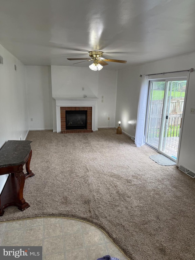 3948 Laurel Run, Columbia, PA 17512 - unfurnished living room featuring ceiling fan, a tile fireplace, carpet floors, and baseboards