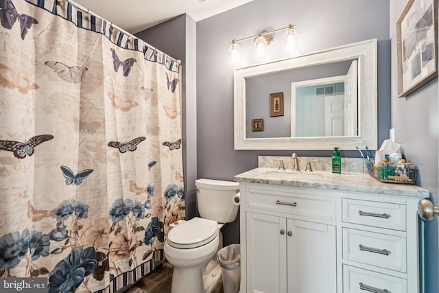 11193 Rienzi Pl Unit 203, Manassas, VA 20109 - bathroom featuring toilet, vanity, wood finished floors, and curtained shower