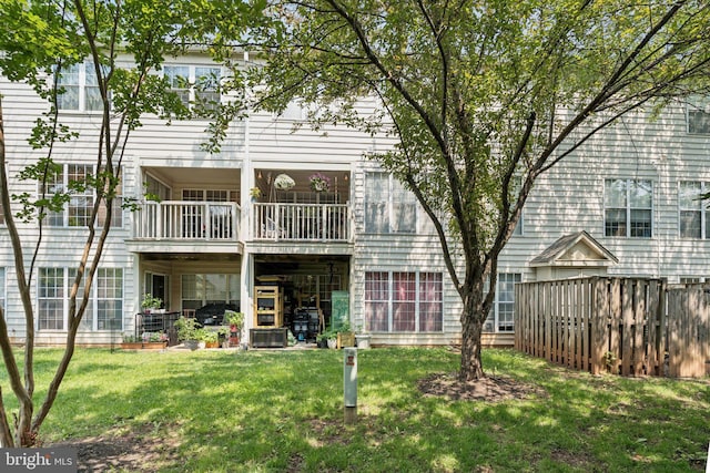 11193 Rienzi Pl Unit 203, Manassas, VA 20109 - rear view of property featuring a lawn and a balcony