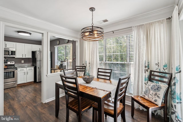 11193 Rienzi Pl Unit 203, Manassas, VA 20109 - dining area with a chandelier, ornamental molding, and dark wood-style floors
