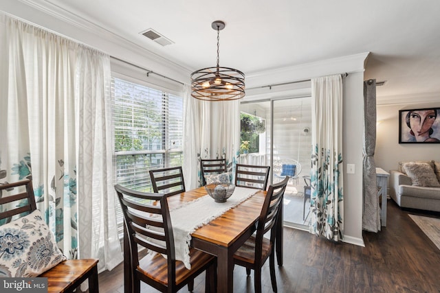11193 Rienzi Pl Unit 203, Manassas, VA 20109 - dining room featuring crown molding, healthy amount of natural light, dark wood finished floors, a chandelier, and baseboards