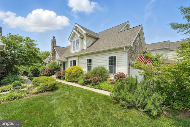 19885 Naples Lakes Ter, Ashburn, VA 20147 - view of front of home with roof with shingles, a front lawn, and a chimney