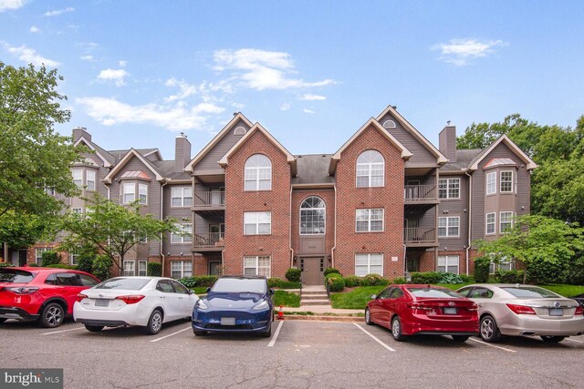 4100 Monument Ct Unit 302, Fairfax, VA 22033 - view of property with uncovered parking
