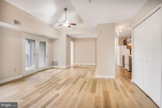 4100 Monument Ct Unit 302, Fairfax, VA 22033 - unfurnished living room featuring ceiling fan, light wood-type flooring, baseboards, and vaulted ceiling