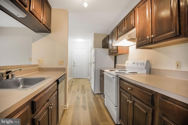 4100 Monument Ct Unit 302, Fairfax, VA 22033 - kitchen featuring white appliances, under cabinet range hood, a sink, light wood-style flooring, and light countertops