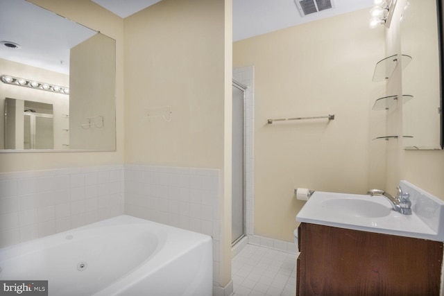 4100 Monument Ct Unit 302, Fairfax, VA 22033 - bathroom with a stall shower, a tub with jets, tile patterned floors, vanity, and baseboards