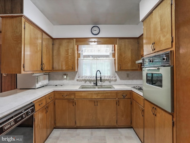193 Chevy Ln, Berkeley Springs, WV 25411 - kitchen with white oven, a sink, dishwasher, and light countertops