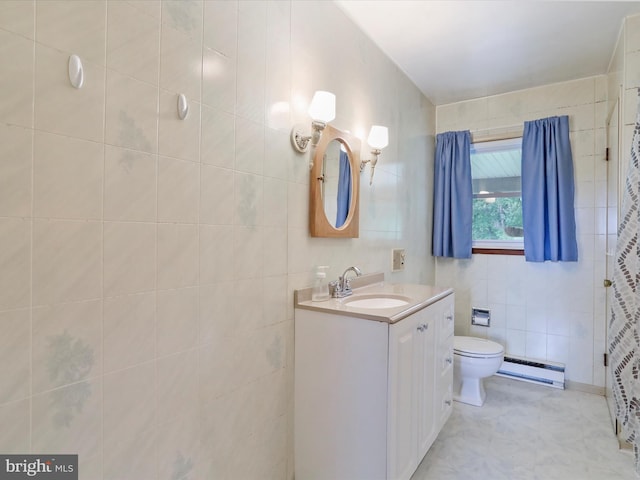 193 Chevy Ln, Berkeley Springs, WV 25411 - bathroom with a baseboard heating unit, vanity, toilet, and tile walls