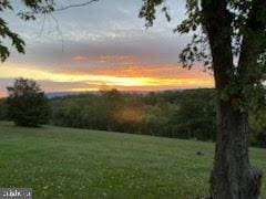 193 Chevy Ln, Berkeley Springs, WV 25411 - yard at dusk with a yard