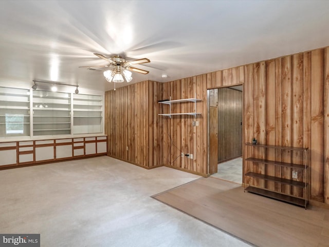 193 Chevy Ln, Berkeley Springs, WV 25411 - carpeted empty room with wooden walls and a ceiling fan