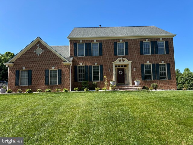 927 Brick Manor Cir, Silver Spring, MD 20905 - view of front facade featuring a front lawn and brick siding