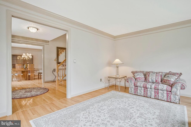 927 Brick Manor Cir, Silver Spring, MD 20905 - living area with wood finished floors, stairs, a chandelier, baseboards, and ornamental molding