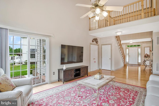 927 Brick Manor Cir, Silver Spring, MD 20905 - living area with wood finished floors, a towering ceiling, plenty of natural light, and ceiling fan