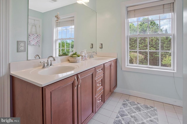 927 Brick Manor Cir, Silver Spring, MD 20905 - full bath with double vanity, tile patterned floors, and baseboards