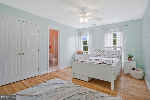 927 Brick Manor Cir, Silver Spring, MD 20905 - bedroom featuring baseboards, wood finished floors, a closet, ensuite bathroom, and a ceiling fan