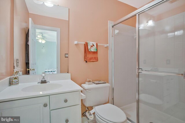 927 Brick Manor Cir, Silver Spring, MD 20905 - full bathroom with toilet, a stall shower, vanity, and ceiling fan