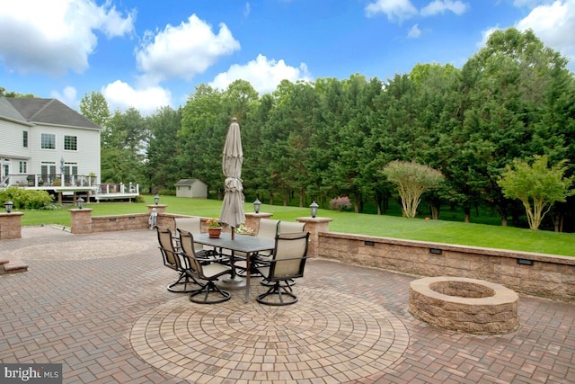 927 Brick Manor Cir, Silver Spring, MD 20905 - view of patio / terrace featuring outdoor dining area, a fire pit, and view of scattered trees