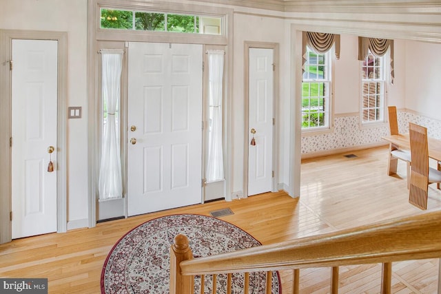 927 Brick Manor Cir, Silver Spring, MD 20905 - foyer with wood finished floors, baseboards, and wallpapered walls