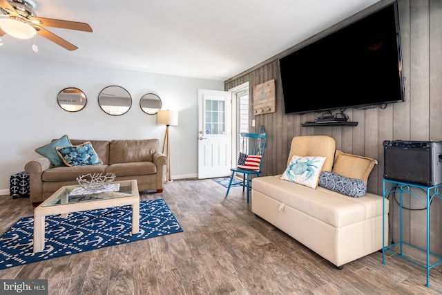 183 Jamestown Rd Unit 10, Ocean City, MD 21842 - living area featuring wood finished floors, ceiling fan, baseboards, and wood walls