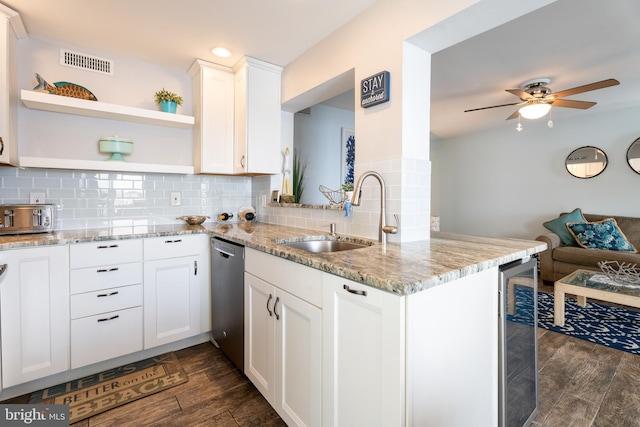 183 Jamestown Rd Unit 10, Ocean City, MD 21842 - kitchen with stainless steel dishwasher, a sink, dark wood-style flooring, decorative backsplash, and open shelves