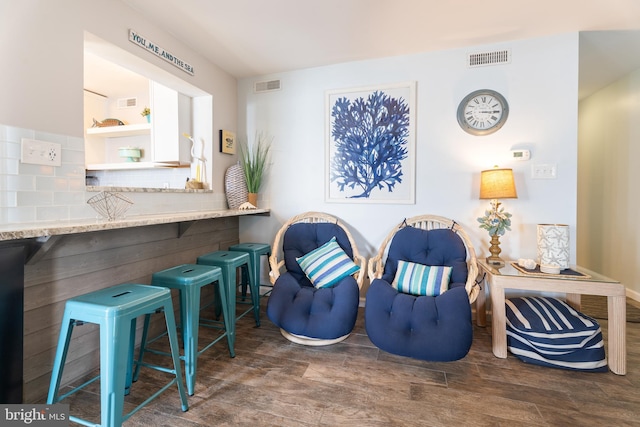183 Jamestown Rd Unit 10, Ocean City, MD 21842 - sitting room with wood finished floors and baseboards