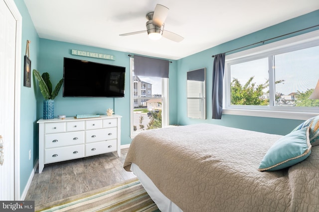 183 Jamestown Rd Unit 10, Ocean City, MD 21842 - bedroom featuring wood finished floors, baseboards, and a ceiling fan